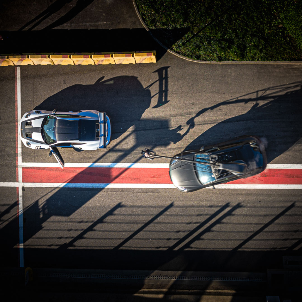 Automotive car shooting of a Porsche 911 GT3 filmed with a U-Crane camera car on a racetrack